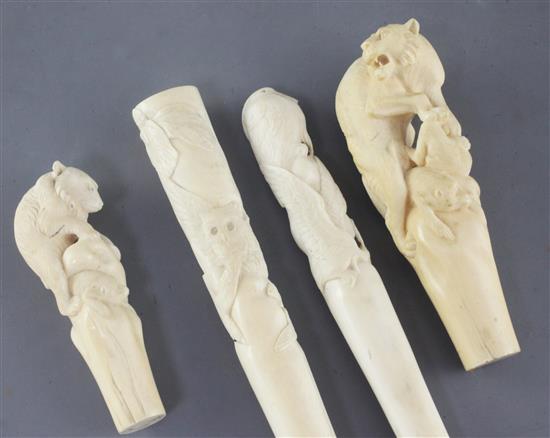 Four Japanese ivory walking stick or parasol handles, Meiji period, 10cm - 22cm